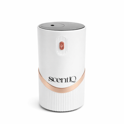 scentIQ waterless diffuser in warm wood grain finish on a neutral background.