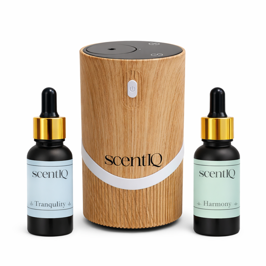 ScentIQ diffuser and bottles on a white background