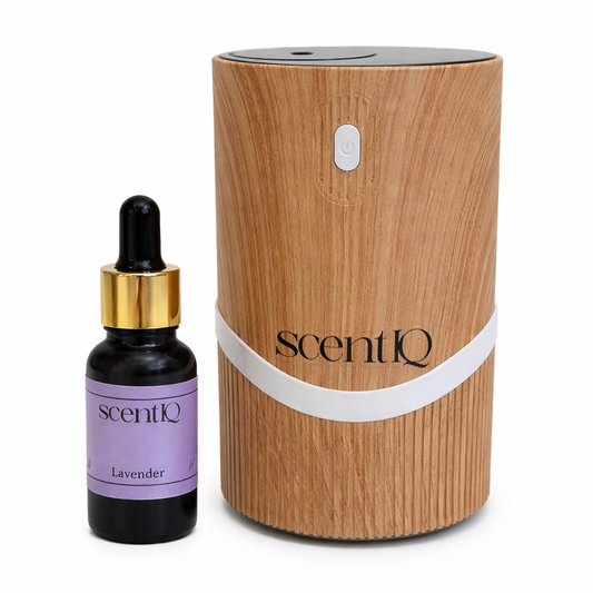 Wooden diffuser and lavender essential oil bottle with 'scentIQ' branding on a white background