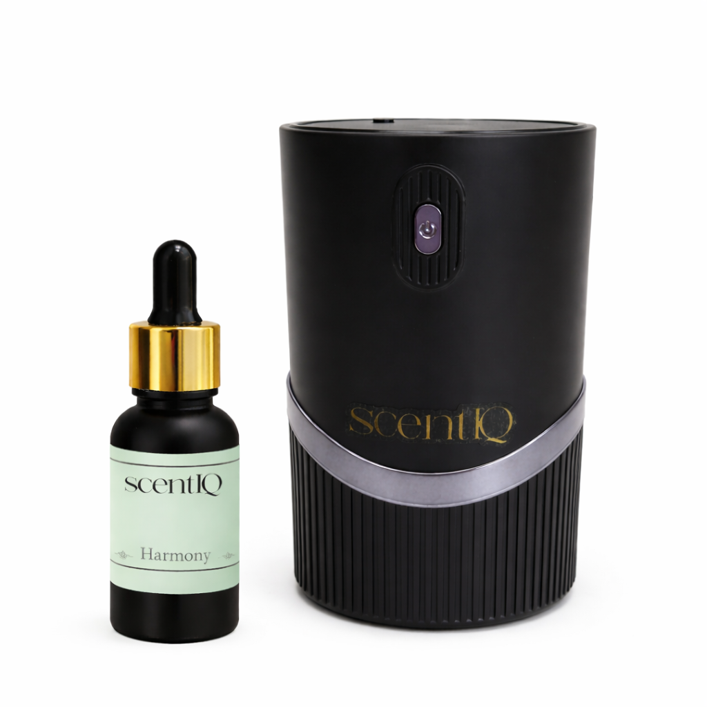 ScentiQ Waterless Diffuser (black) and dropper bottle on a white background
