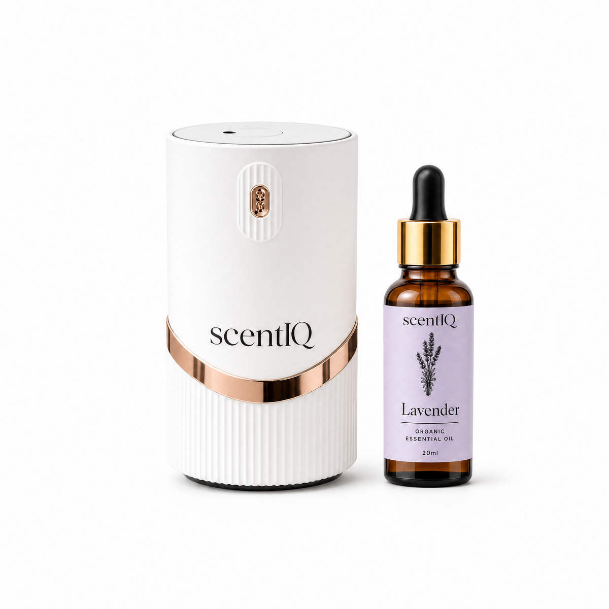 A white and rose gold scented diffuser next to a lavender essential oil dropper bottle on a clean white background.